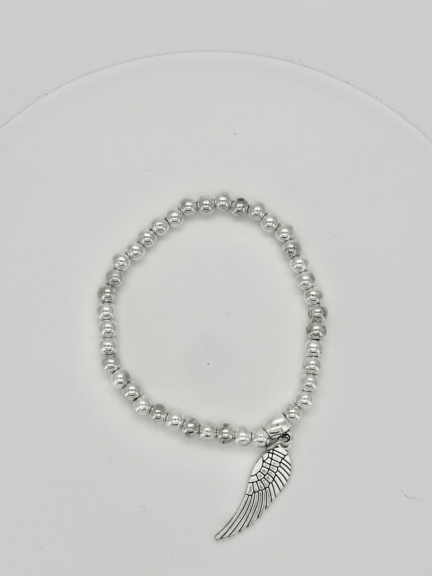 Charm beaded elasticelated  bracelets in silver Pxx