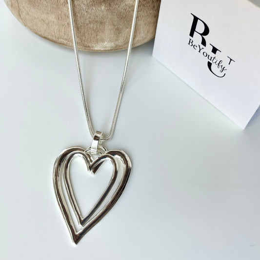 Long double heart statement necklace