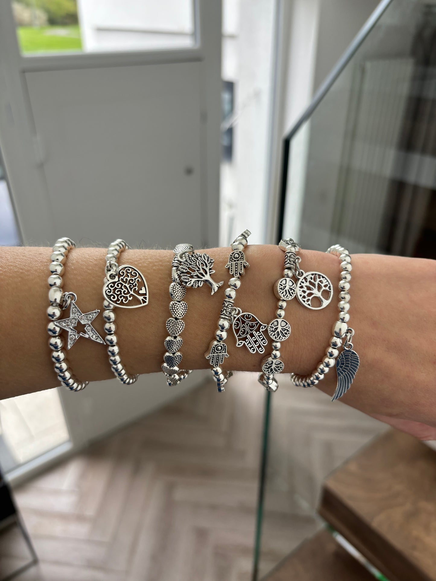 Charm beaded elasticelated  bracelets in silver Pxx