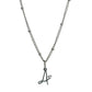 Cursive Initial necklace with heart detail in silver tone water and tarnish resistant